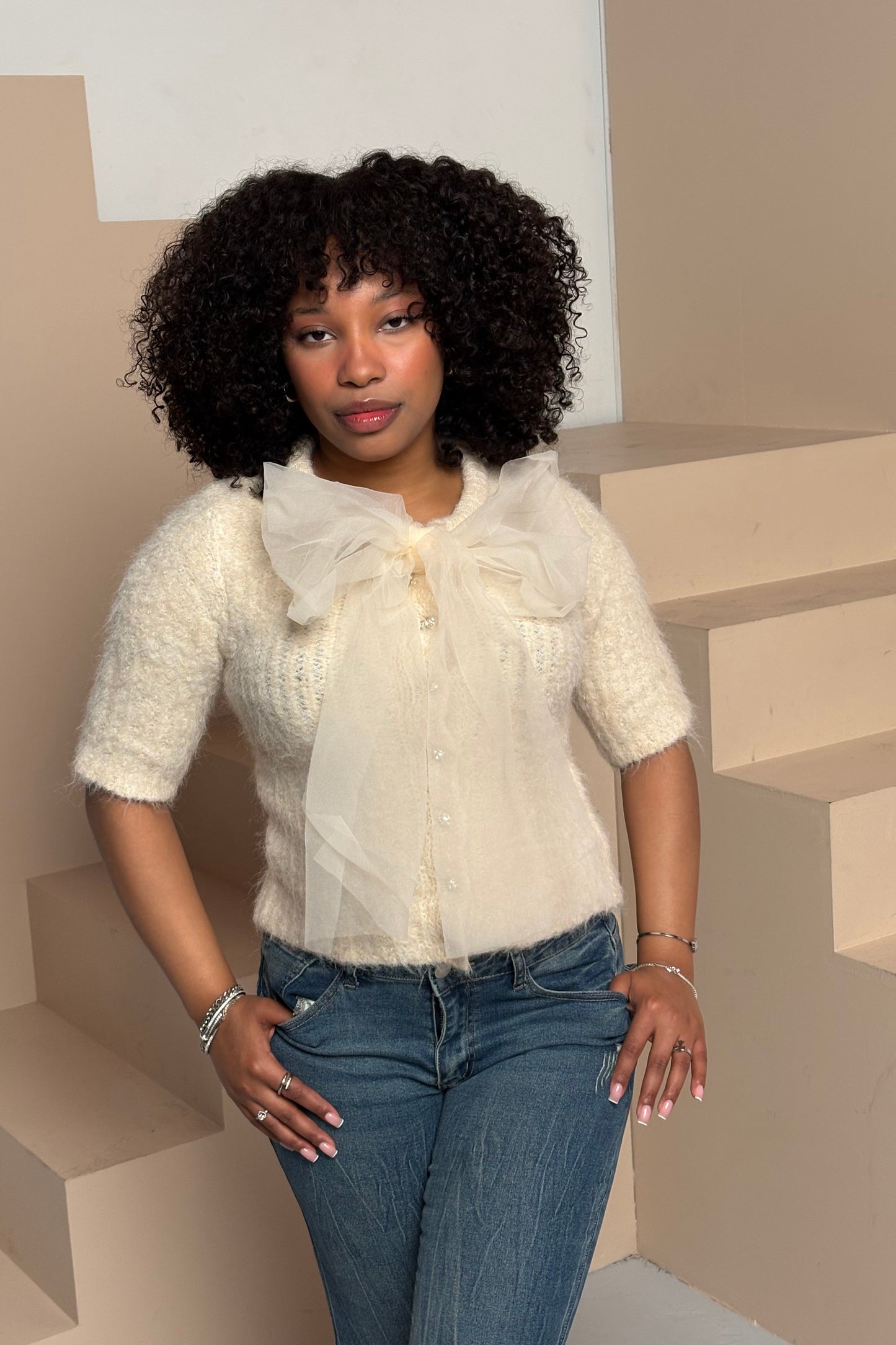 Women's fuzzy bow sweater top cream knit front view — Baebekillinem