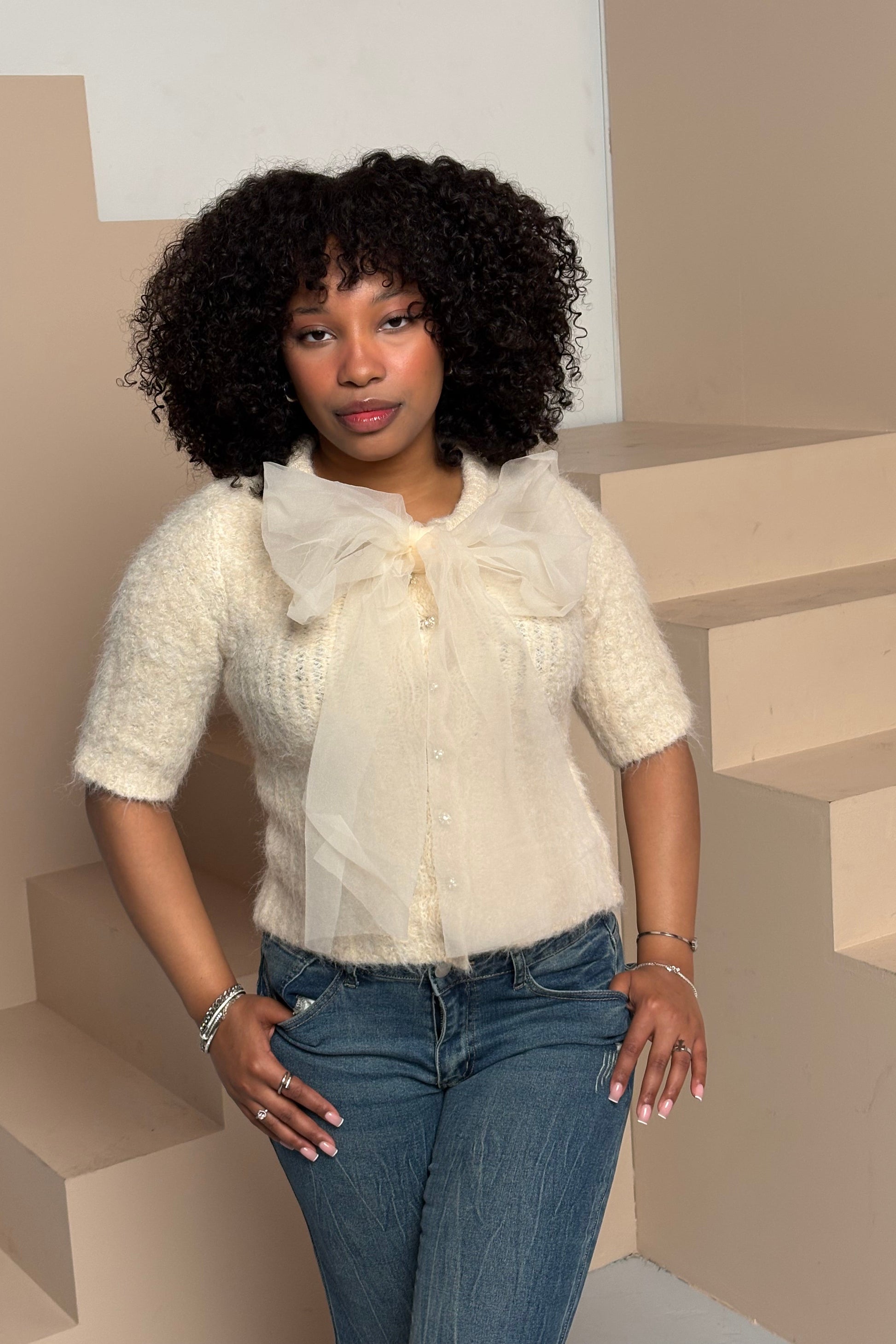 Women's fuzzy bow sweater top cream knit front view — Baebekillinem