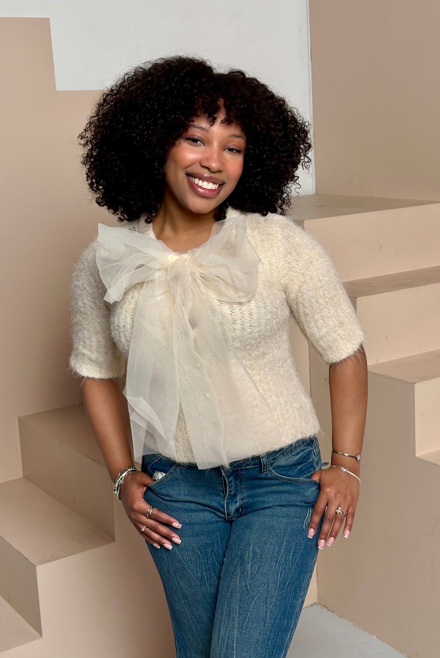 Women's fuzzy bow sweater top cream knit front view — Baebekillinem